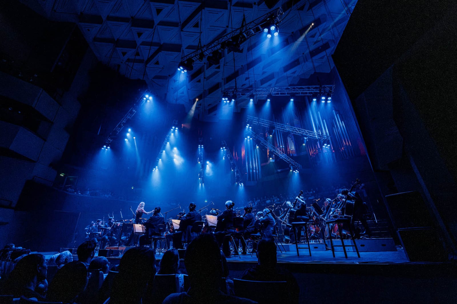 QSO Art of the Score: Hans Zimmer: orchestra under saturated wash and beam lighting, operated by Krank’d